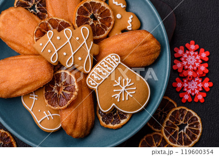 French classic madeleine sponge cake with elements of Christmas motifs French classic madeleine sponge cake with elements of Christmas motifs 119600354