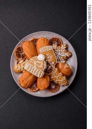 French classic madeleine sponge cake with elements of Christmas motifs 119600361
