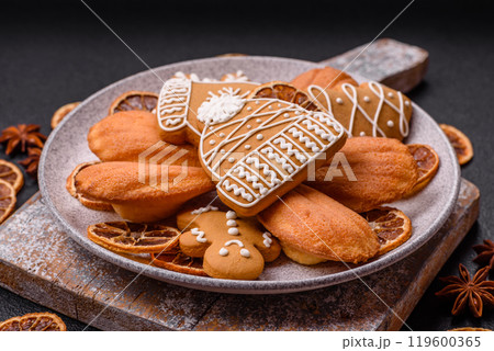 French classic madeleine sponge cake with elements of Christmas motifs French classic madeleine sponge cake with elements of Christmas motifs 119600365