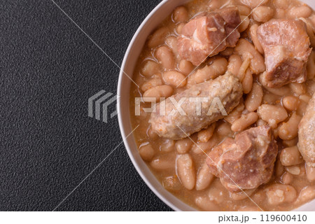 Cassoulet with white beans, meat and sausages, vegetables, salt and spices Cassoulet with white beans, meat and sausages, vegetables, salt and spices 119600410