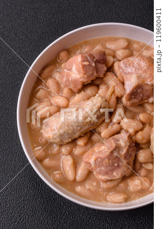 Cassoulet with white beans, meat and sausages, vegetables, salt and spices 119600411