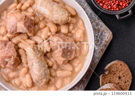 Cassoulet with white beans, meat and sausages, vegetables, salt and spices 119600413