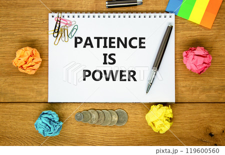 Patience is power symbol. Concept words Patience is power on beautiful white note. Beautiful wooden background. Black pen. Colored paper. Business and patience is power concept. Copy space. 119600560