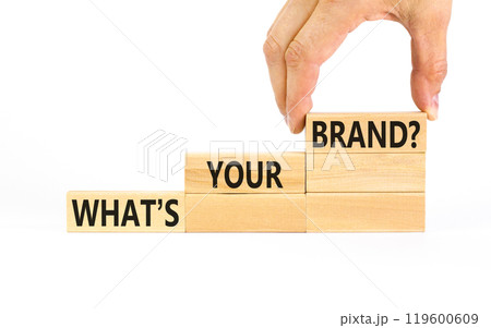 Branding and what is your brand symbol. Concept words What is your brand on beautiful blocks. Beautiful white background. Businessman hand. Business branding what is your brand concept. Copy space. 119600609