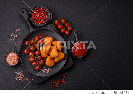 Breaded camembert or brie cheese baked in the form of nuggets with salt and spices 119600728