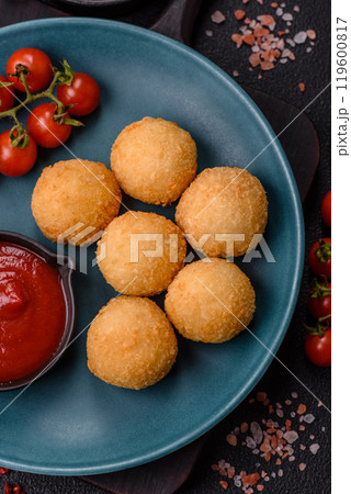 Fast food cheese balls breaded with salt and spices 119600817
