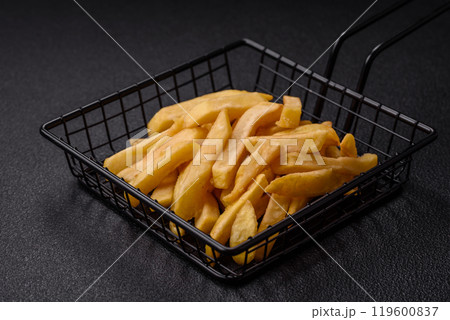 Fast food french fries with salt and spices 119600837