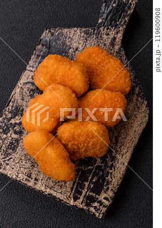 Fast food chicken nuggets breaded with salt and spices Fast food chicken nuggets breaded with salt and spices 119600908