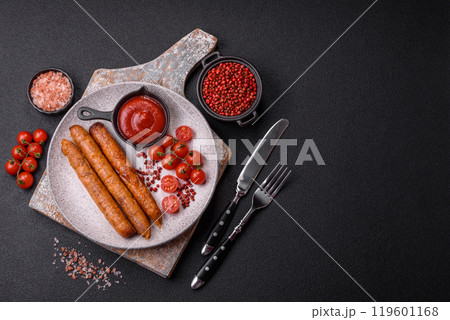 Juicy fried beef or pork sausages with salt, spices and herbs 119601168