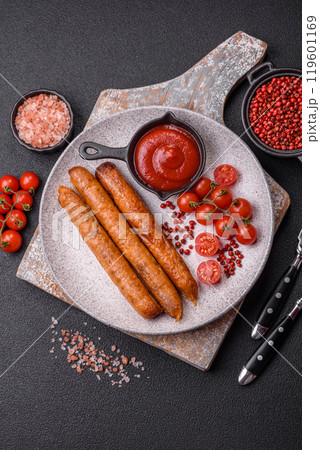 Juicy fried beef or pork sausages with salt, spices and herbs 119601169