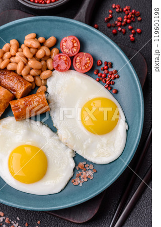 Full English breakfast with boiled eggs, beans, sausages, tomatoes Full English breakfast with boiled eggs, beans, sausages, tomatoes 119601198