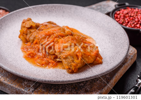 Sliced fish in tomato sauce with salt and spices 119601301