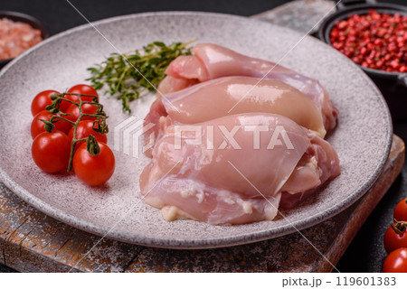 Fresh chicken fillet on a dark concrete table with spices and herbs 119601383