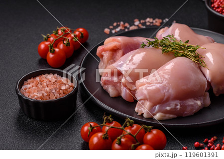 Fresh chicken fillet on a dark concrete table with spices and herbs 119601391