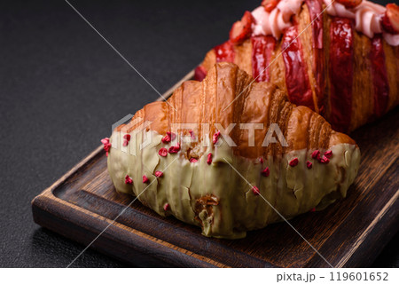 Crispy sweet red croissant with pistachio, raspberry and strawberry Crispy sweet red croissant with pistachio, raspberry and strawberry 119601652