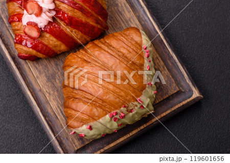 Crispy sweet red croissant with pistachio, raspberry and strawberry Crispy sweet red croissant with pistachio, raspberry and strawberry 119601656