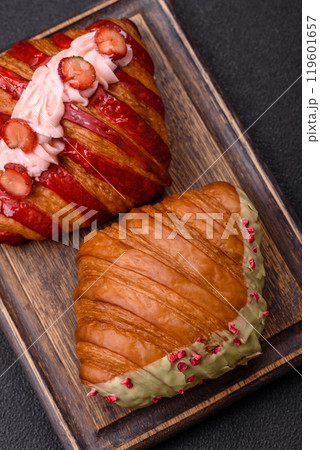 Crispy sweet red croissant with pistachio, raspberry and strawberry Crispy sweet red croissant with pistachio, raspberry and strawberry 119601657