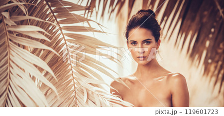 beautiful girl in wihite palm leaves. young sexy body woman 119601723