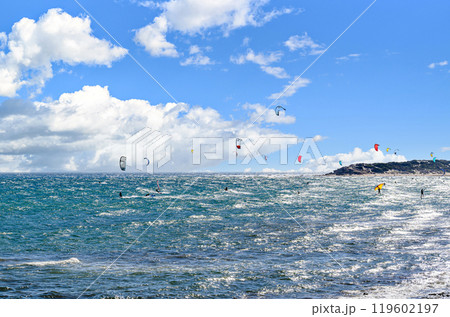 Los Canos de Meca, Barbate, Cadiz; August 19, 2022: athletes practicing kitesurfing in front of the beach of the Trafalgar Lighthouse Los Canos de Meca, Barbate, Cadiz; August 19, 2022: athletes practicing kitesurfing in front of the beach of the Trafalgar Lighthouse 119602197