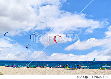Los Canos de Meca, Barbate, Cadiz; August 19, 2022: athletes practicing kitesurfing in front of the beach of the Trafalgar Lighthouse Los Canos de Meca, Barbate, Cadiz; August 19, 2022: athletes practicing kitesurfing in front of the beach of the Trafalgar Lighthouse 119602199