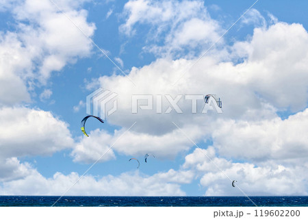 Los Canos de Meca, Barbate, Cadiz; August 19, 2022: athletes practicing kitesurfing in front of the beach of the Trafalgar Lighthouse Los Canos de Meca, Barbate, Cadiz; August 19, 2022: athletes practicing kitesurfing in front of the beach of the Trafalgar Lighthouse 119602200