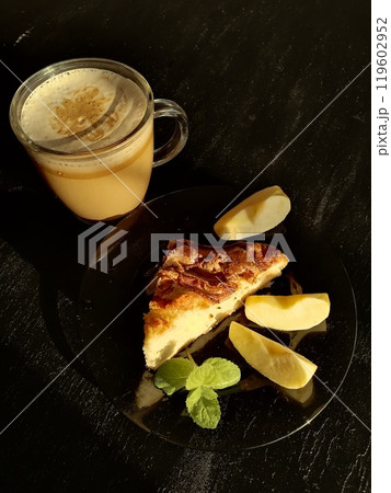 Сup of coffee tea on the table with a homemade cake decorated with a fresh mint 119602952
