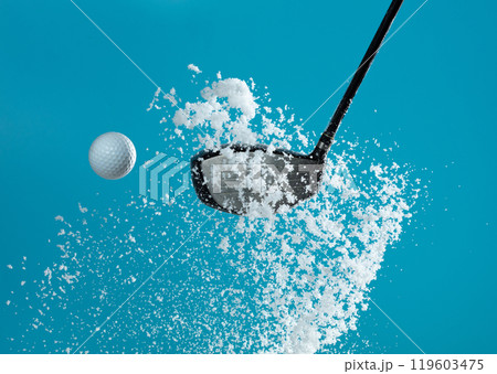 Golf Ball golfer hit snow to explode and splatter. Sand wedge golf dick ball from snow field and snow fly in air. Blue sky background isolated Golf Ball golfer hit snow to explode and splatter. Sand wedge golf dick ball from snow field and snow fly in air. Blue sky background isolated 119603475