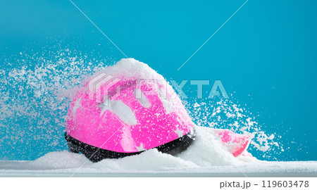 Pink safety helmet gear was covered with snow winter. Snow winter make bicycle slippery road so Safety helmet gear help protective children from danger. Blue Sky background isolated Pink safety helmet gear was covered with snow winter. Snow winter make bicycle slippery road so Safety helmet gear help protective children from danger. Blue Sky background isolated 119603478