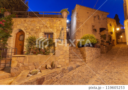 Cobbled Street and Stone Houses at Night in Tossa de Mar, Spain Cobbled Street and Stone Houses at Night in Tossa de Mar, Spain 119605253