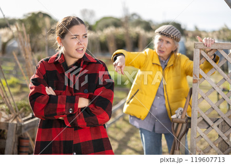 Conflict between female neighbors in country farm Conflict between female neighbors in country farm 119607713