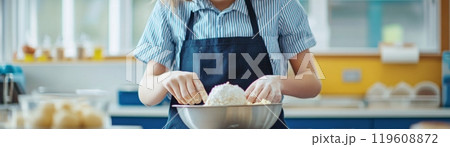 Student cooking with a bowl. Preparation food like a chef in a school kitchen cooking class 119608872