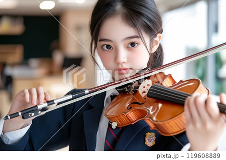 Student playing music instrument at the school music room Student playing music instrument at the school music room 119608889
