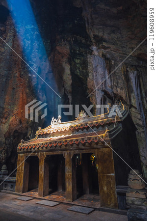 interior of the Vietnamese sacred Buddhist temple inside Huyen Huong Cave in the Marble Mountains in Da Nang in Vietnam in Asia 119608959