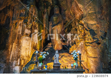Buddhist temple with statues and a sanctuary inside Tong Chon Cave in the Marble Mountains in Da Nang in Vietnam Buddhist temple with statues and a sanctuary inside Tong Chon Cave in the Marble Mountains in Da Nang in Vietnam 119608974
