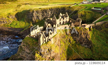 Dunluce Castle in Northern Ireland aerial view - Ancient Ruins Majestically Overlooking the Glorious 119609114