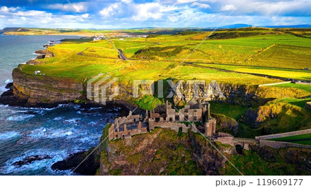 Dunluce Castle in Northern Ireland aerial view - Ancient Ruins Majestically Overlooking the Glorious 119609177