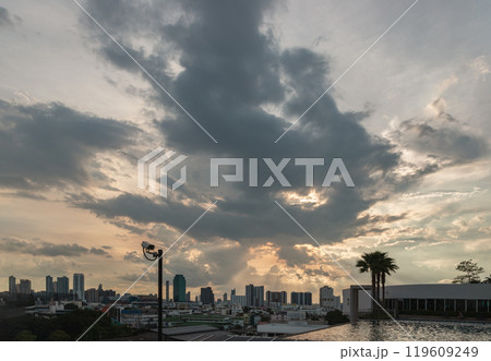 View of skyscrapers and dramatic sky before sunset. 119609249