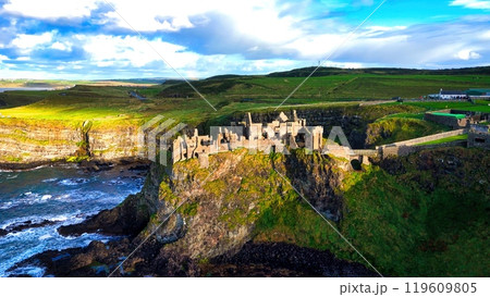 Dunluce Castle in Northern Ireland aerial view - Ancient Ruins Majestically Overlooking the Glorious 119609805