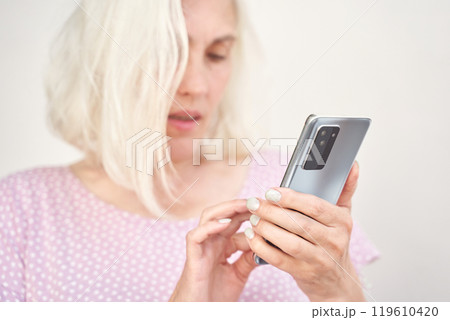Woman with smartphone casual interaction with technology in everyday life Woman with smartphone casual interaction with technology in everyday life 119610420