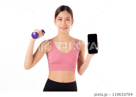 Portrait young asian woman lifting dumbbell and showing smartphone isolated. 119610704