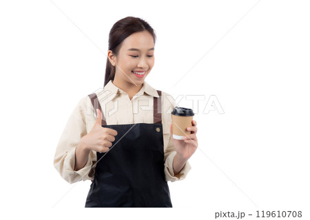 Cheerful young asian woman barista in casual work attire happily holding a takeaway coffee cup. 119610708