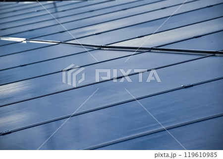 closeup photovoltaic panels which installed on the rooftop of the building, concept for storing and using natural power from the sunlight to care about human environment over the world. 119610985