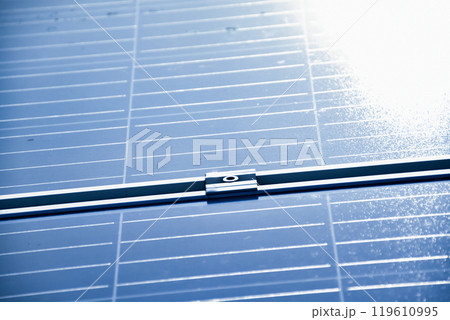 closeup photovoltaic panels which installed on the rooftop of the building, concept for storing and using natural power from the sunlight to care about human environment over the world. closeup photovoltaic panels which installed on the rooftop of the building, concept for storing and using natural power from the sunlight to care about human environment over the world. 119610995