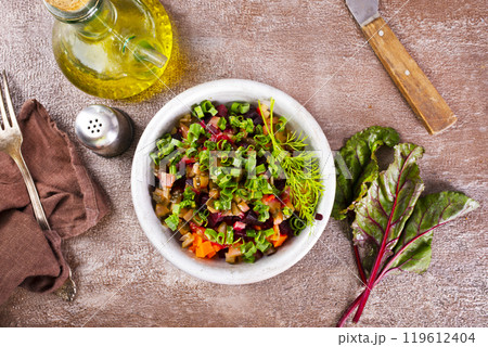 Beet salad in bowl over light stone background. Healthy detox salad with beetroot 119612404