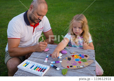 Young father with little preschooler daughter drawing together, caring dad have fun relax with small girl child paint 119612918