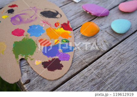 Flat stones painted with acrylic paints. Do it yourself. Souvenirs that children can make. Flat stones painted with acrylic paints. Do it yourself. Souvenirs that children can make. 119612919