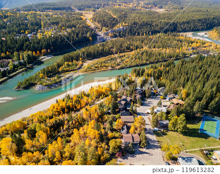 Aerial view of Bow river in autumn. Canmore, Alberta, Canada. Hydroelectric power plants above Town of Canmore in the Canadian Rockies. 119613282