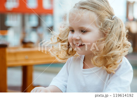 A Playful Child Happily Enjoying Various Outdoor 119614192