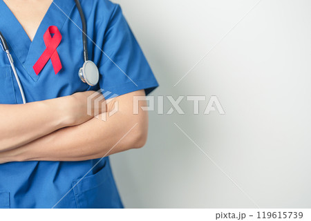 Doctor with Red Ribbon for December World Aids Day, acquired immune deficiency syndrome, multiple myeloma Cancer Awareness month and National Red ribbon week. Healthcare and world cancer day concept Doctor with Red Ribbon for December World Aids Day, acquired immune deficiency syndrome, multiple myeloma Cancer Awareness month and National Red ribbon week. Healthcare and world cancer day concept 119615739