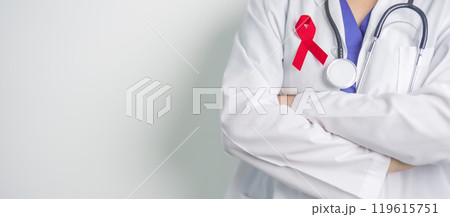 Doctor with Red Ribbon for December World Aids Day, acquired immune deficiency syndrome, multiple myeloma Cancer Awareness month and National Red ribbon week. Healthcare and world cancer day concept Doctor with Red Ribbon for December World Aids Day, acquired immune deficiency syndrome, multiple myeloma Cancer Awareness month and National Red ribbon week. Healthcare and world cancer day concept 119615751
